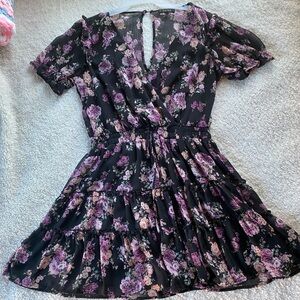 black flowy party dress with purple & pink flowers
